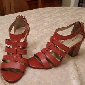 Open toe burnt orange sandal with zip back